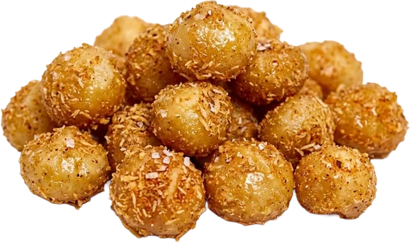 A heap of macadamias coated in toasted coconut